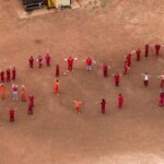 Migrants at Texas detention center spell out ‘SOS’ in human chain